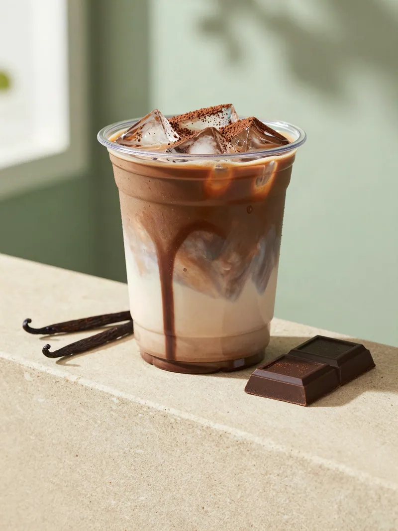 An iced mocha with chocolate drizzle
